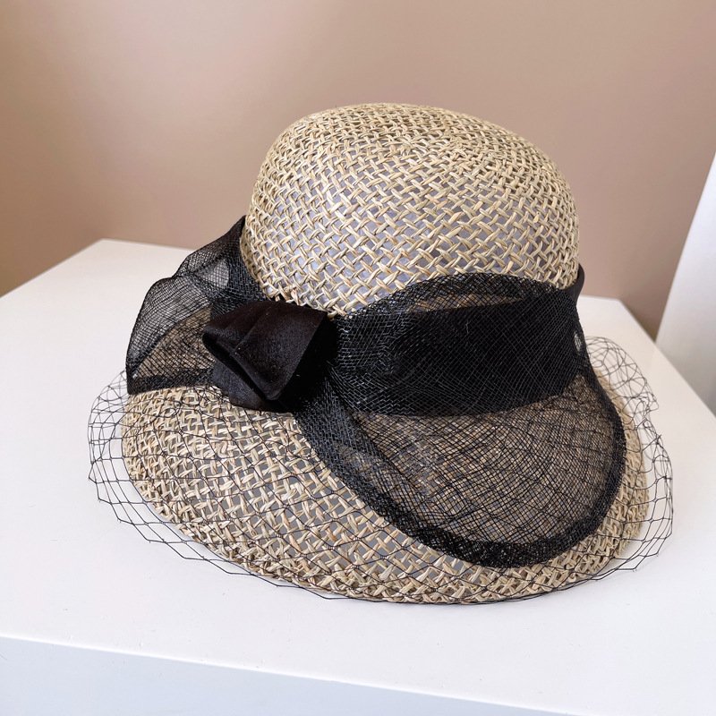 09968b29-aa9a-41e8-95c8-451cd4808c84.jpg Cambric Big Bowknot Bucket Hat - Image 1